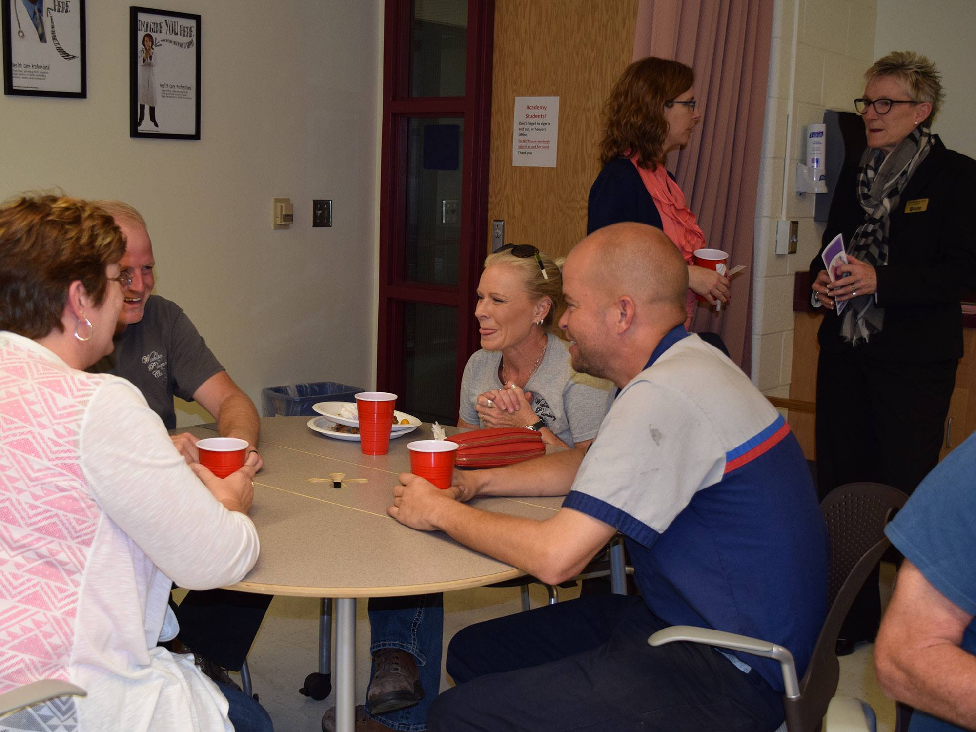 Chamber members and guests mingle during the chamber mixer hosted by Butler Community College.